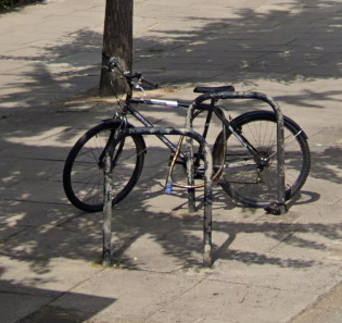 File:Bicycle stand in a street, London.png