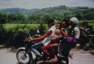 File:Tasaday on motorbike 1997.jpg