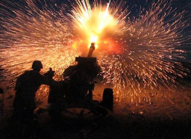 File:Firing a 105mm shell from a howitzer.jpg