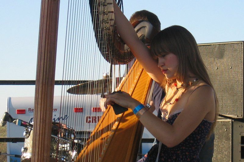 File:Joanna Newsom tunes harp.jpg