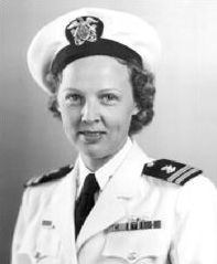 A young white woman in a white Navy uniform, with cap and necktie.