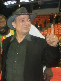 New IBO International middleweight champion Osumanu Adama (center) with his manager Wasfi Tolaymat in the ring at UIC Pavilion in Chicago, December 2010