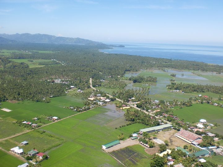 File:Aerial photo ricefields and Sea.jpg