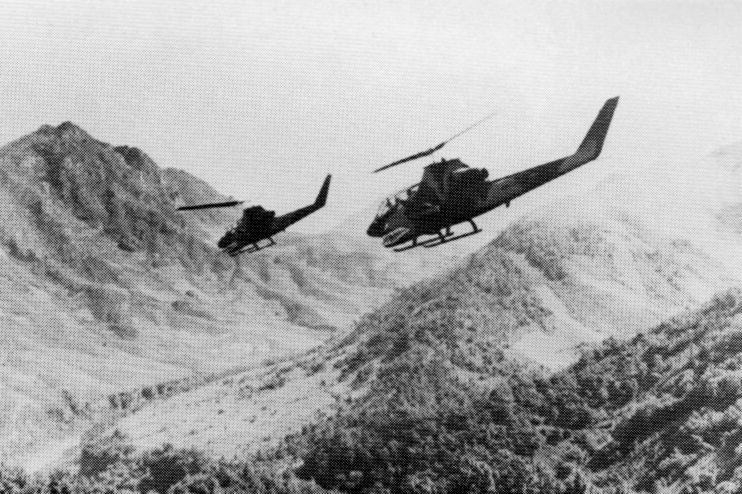 File:US Army AH-1G HueyCobras over Laos 1971.jpg