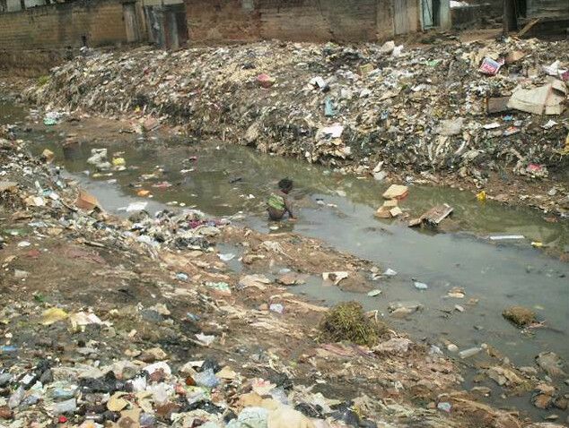 File:Child in open sewer in Nigeria (3150664698).jpg