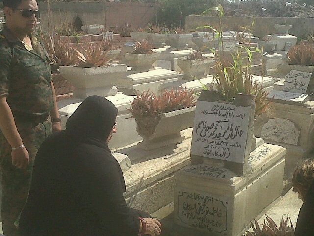 File:Khaled Mohamed Saeed's mother visiting his grave.jpg