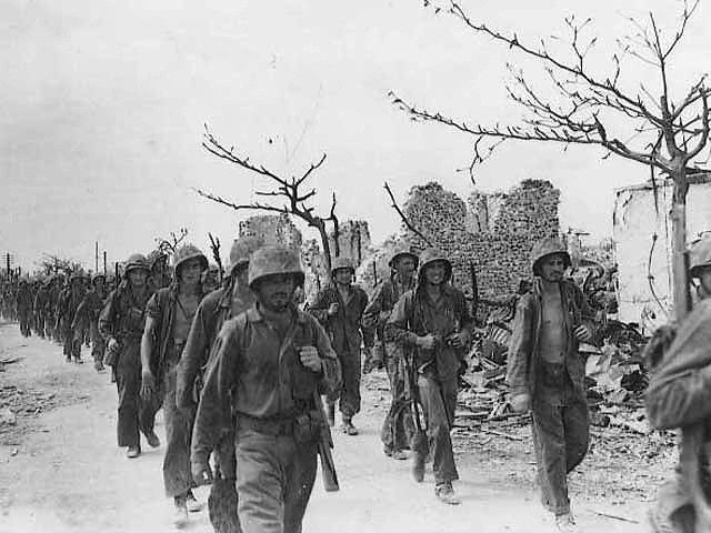 File:Marines march through Garapan.jpg