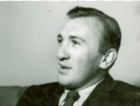 A black-and-white photograph of Eduardo Wiesner Durán wearing a suit and tie, cropped to show his head and shoulders