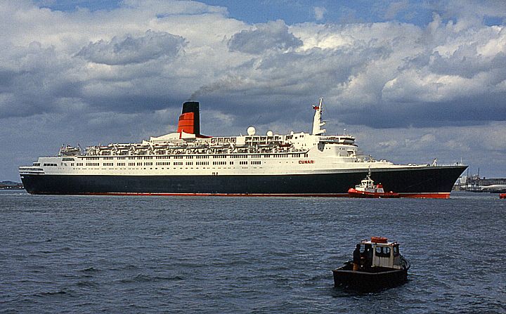 File:Chale assisting QE2.jpg