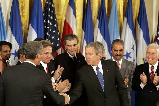 File:Bush shakes hands after signing CAFTA.jpg