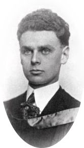 Formal photo portrait of Diefenbaker at age 23. His short dark hair is very thick and curly and has been combed back smoothly, and his face is thinner than at an older age. He is formally dressed with a stiffened shirt collar and wears an academic hood. Picture is inscribed "J.G. Diefenbaker, law".