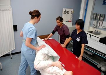 File:Transfer board and patient.jpg