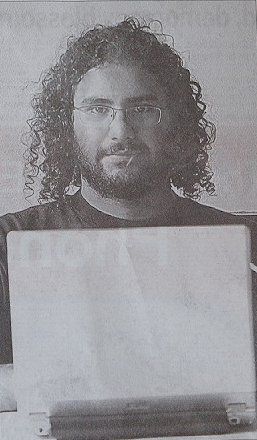 File:Alaa Abd El-Fatah using his laptop.jpg