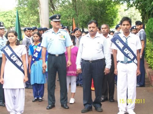 File:Principal at receiving chief guest.jpg