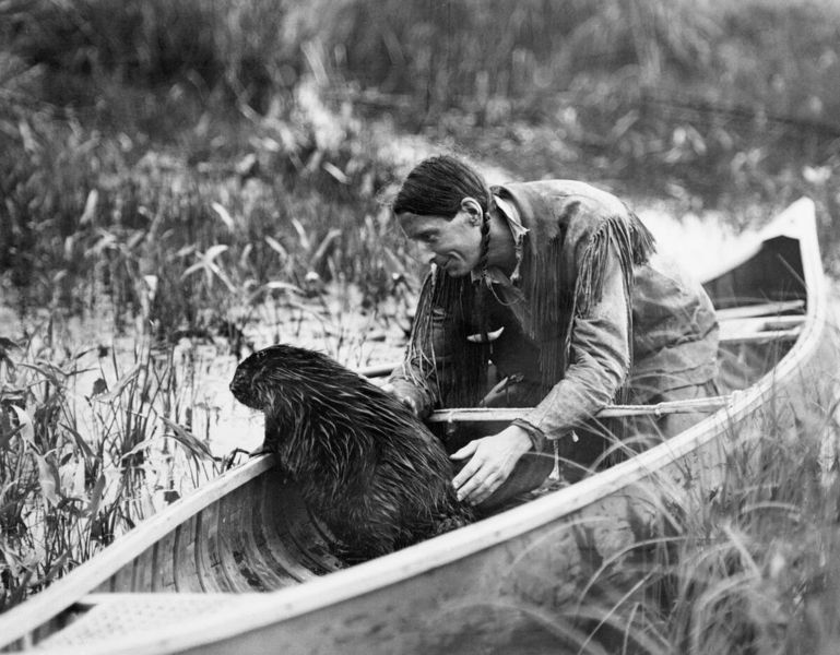 File:Grey Owl with Beaver, Lake Ajawaan, Saskatchewan.jpg