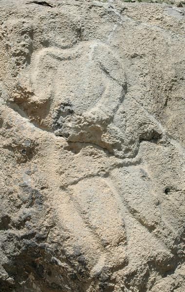 File:Behistun, free-standing Parthian rock (left attendant).jpg