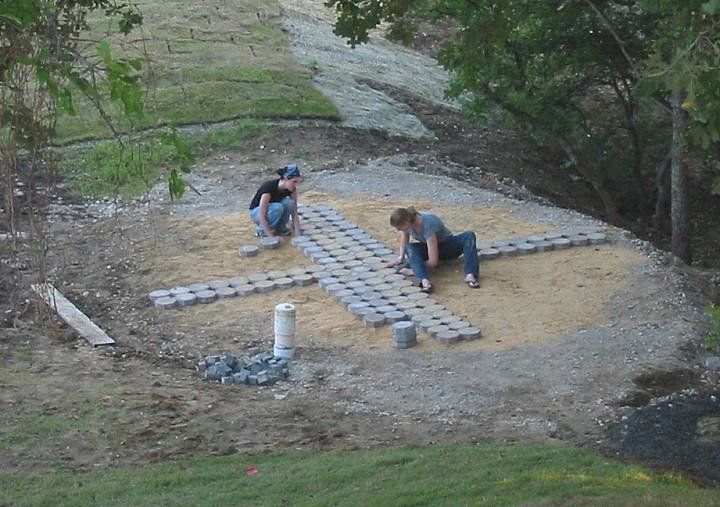 File:Annie and Ry laying bricks.JPG