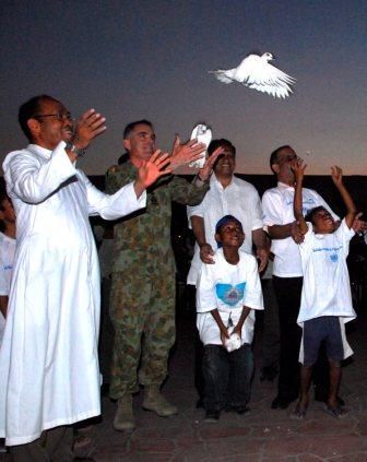 File:Brigadier Mark Holmes releases a dove.jpg