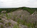 Unrehabilitated land in older part of Aidu mine.