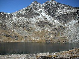 In late April 2007, the snow is minimal. In winter it is frozen solid. the double cone peaks of The Remarkables are in the background.