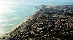 Aerial view of Ostia, with the Tiber and its mouth in the background