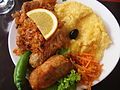 Image 23A popular Moldovan dish of Stuffed Cabbage Rolls (sarma), accompanied by sauerkraut and mămăligă. (from Culture of Moldova)