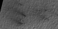 Close view of defrosting, as seen by HiRISE under HiWish program. Gas and dark dust is probably being blown out of ground and then carried by winds toward the Northwest.