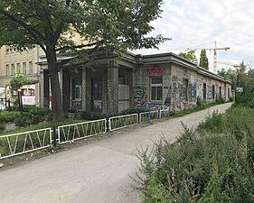 Low-rise building on property, north corner