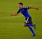 Man in blue uniform running on field.