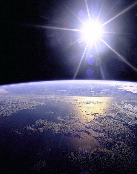 File:Sunburst over Earth.JPG