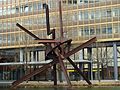 Sculpture of Galileo by Mark di Suvero on the Piano Lake at the Atrium Tower