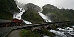 A road bridge across a waterfall