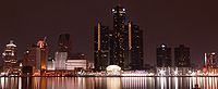 A view looking south down Brush Street at the Renaissance Center (rear left) and the Wayne County Building (right) in Detroit, Michigan.