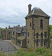 Side view of Shibden Hall with gothic tower in foreground