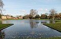 Upper pond looking towards the NPL. The Victorian Mews is on the left and Upper Lodge centre left. The tops of the alcoves are visible to either side of the gap where the Upper pond flows over the cascade