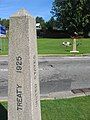 International boundary markers (the columns at each side of the road) at Peace Arch Park.