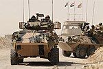 Two ASLAVs in Iraq during the transition from the Al Muthanna Task Group to Overwatch Battle Group (West)