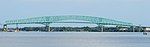 The Hart Bridge spanning the St. Johns River in Jacksonville, Florida, is a continuous, cantilevered truss bridge which combines a suspended road deck on the 332-metre (1,088 ft) main span and through truss decks on the adjacent approach spans