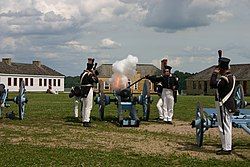 Minnesota Historical Society Historic Interpreters firing a cannon at the fort.