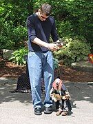 A puppeteer manipulating a marionette