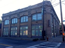 Image of a two-story brown brick square building