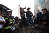 President George W. Bush speaking at Ground Zero with Bob Beckwith beside him.