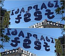 A practical application of mirror ambigrams in a banner reading "Idaplatz fest" front and back (Zürich, 2008).