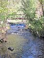 Footbridge over Great Hollow Lake babbling brook