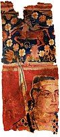 The Sampul tapestry, a woollen wall hanging from Lop County, Hotan Prefecture, Xinjiang, China, showing a possibly Greek soldier from the Greco-Bactrian kingdom (250–125 BC), with blue eyes, wielding a spear, and wearing what appears to be a diadem headband; depicted above him is a centaur, from Greek mythology, a common motif in Hellenistic art;[112] Xinjiang Region Museum.