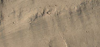 Color view of grooves on wall of Kasei Valles, as seen by HiRISE under HiWish program. Grooves may be caused by water moving in the channel.