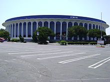 A concrete building with the words "Great Western Forum" on top situates across an empty parking lot