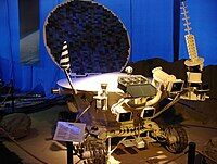 Model of Lunokhod 2. The retroreflector is the hexagonal box with open lid in the front.