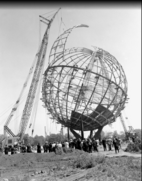 A crane installing the last segment of the Unisphere