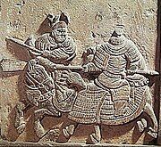 Relief of a Jin rider facing off against a Song cavalryman